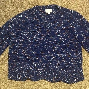 dark blue sweater with pink and light blue dots